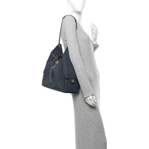 Canvas Quilted Medium Chanel 25 Handbag Dark Blue